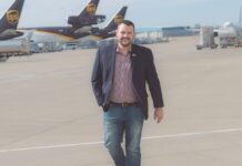 Jeff Wafford walking on runway between UPS planes