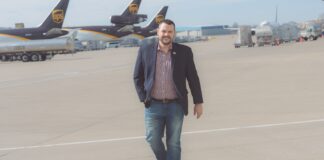 Jeff Wafford walking on runway between UPS planes