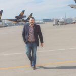 Jeff Wafford walking on runway between UPS planes