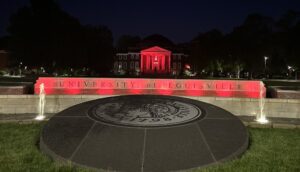 On May 9, Grawemeyer fountains and SAC clock tower on the Belknap Campus were shining red in honor of legendary basketball coach Denny Crum.