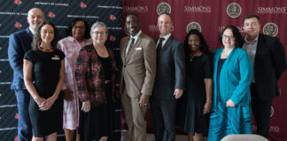 Researchers embarking on a project to understand the Universal Basic Neighborhood, UofL's Ted Smith and Lauren Anderson, Simmons College of Kentucky's Nancy Seay, UofL President Kim Schatzel, Simmons College President Kevin Cosby and Joel Goza, Shavonnie Carthens of University of Kentucky and Patricia Reeves of Simmons and Michael O. Emerson of Rice University