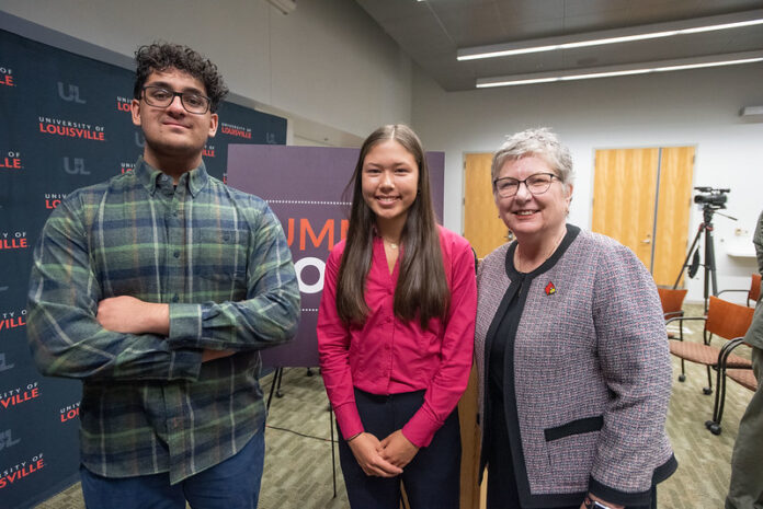 Louisville Science Pathways youth participants Zaheeb Tariq and Liz Bryant with UofL President Kim Schatzel