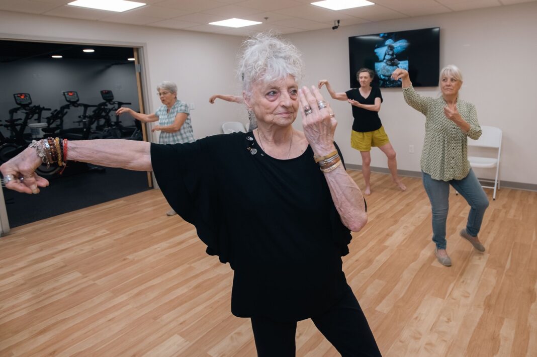 Mary Furlong Coomer, an 82-year-old West Louisville resident, takes tai chi class at UofL’s Trager institute. UofL photo.