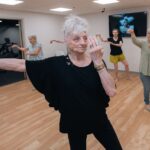 Mary Furlong Coomer, an 82-year-old West Louisville resident, takes tai chi class at UofL’s Trager institute. UofL photo.