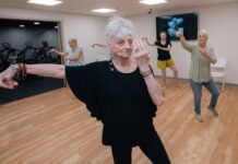 Mary Furlong Coomer, an 82-year-old West Louisville resident, takes tai chi class at UofL’s Trager institute. UofL photo.