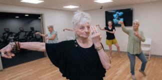 Mary Furlong Coomer, an 82-year-old West Louisville resident, takes tai chi class at UofL’s Trager institute. UofL photo.