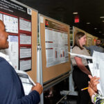 UofL student Leshaia Davis-Johnson and judges Faye Jones and Ryan Simpson