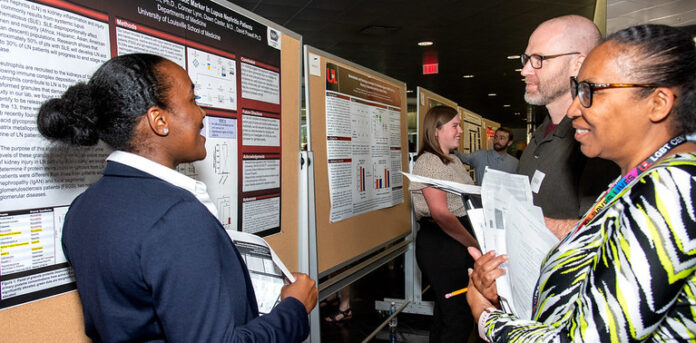 UofL student Leshaia Davis-Johnson and judges Faye Jones and Ryan Simpson