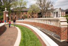 Students walking in front of Grawemeyer Hall oval
