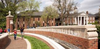 Students walking in front of Grawemeyer Hall oval