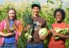 Mackenzie Williams, left, with her “house-sibling” Daylan and another ranch resident Paige on the farm where she was forced to work. (Photo by Mackenzie Williams)