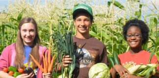 Mackenzie Williams, left, with her “house-sibling” Daylan and another ranch resident Paige on the farm where she was forced to work. (Photo by Mackenzie Williams)