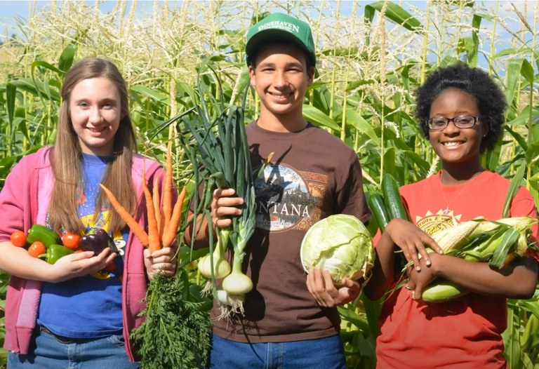 Mackenzie Williams, left, with her “house-sibling” Daylan and another ranch resident Paige on the farm where she was forced to work. (Photo by Mackenzie Williams)