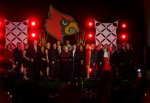 President Kim Schatzel on stage with honorees at the 2023 Alumni Awards.