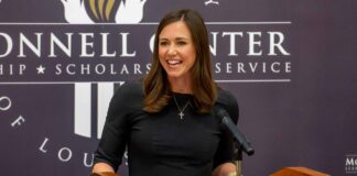 Katie Britt speaks at a podium in the McConnell Center.