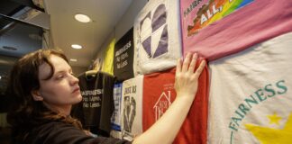 Cassidy Meurer, co-curator of "Fairness Does a City Good: A 25 Year Retrospective," in the lower level of UofL's Ekstrom library.