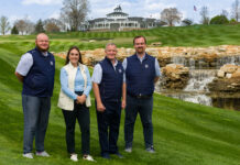3 men and a woman on a golf course