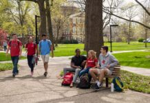 UofL launches new debt forgiveness program for returning students UofL students walking and sitting on campus.