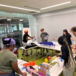 UofL students sort supplies as part of a five-day alternative service break in Chicago focused on environmental and housing justice.