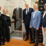 UofL administrators and family members of Louis D. Brandeis stand by the case containing the robe worn by namesake of UofL Law School, U.S. Supreme Court Justice Louis D. Brandeis.