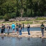 A group of anglers fish at Falls of the Ohio State Park