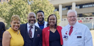 Group standing outside the School of Medicine