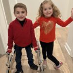 Patrick Leonards, left, is one of the children who has experienced significant recovery thanks to therapy he received at UofL’s Kosair for Kids Center for Pediatric NeuroRecovery.