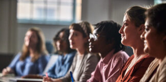 Students listening in the classroom.