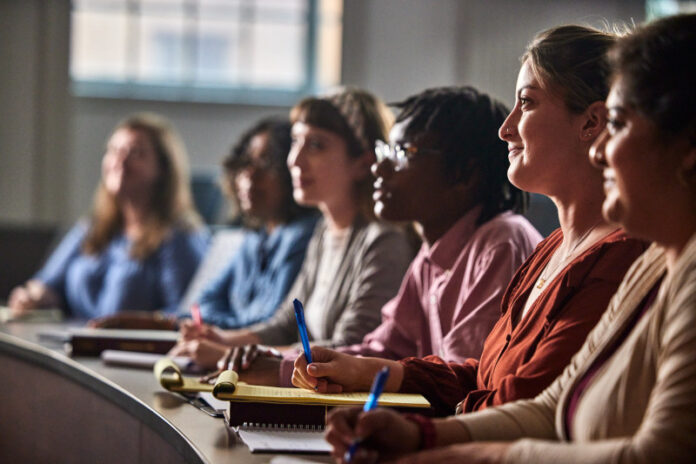 Here_and_Beyond_Campaign Students listening in the classroom.