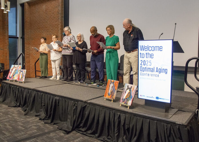 2025 Optimal Aging Conference Older adults singing on stage.