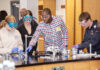 Students work on a chemistry experiment in a lab