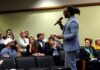 Man talks with an audience
