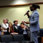 Man talks with an audience