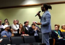 Man talks with an audience