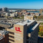 an overhead view of UofL's HSC Campus with the Louisville skyline in the backgroun