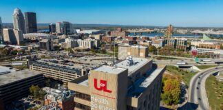 an overhead view of UofL's HSC Campus with the Louisville skyline in the backgroun