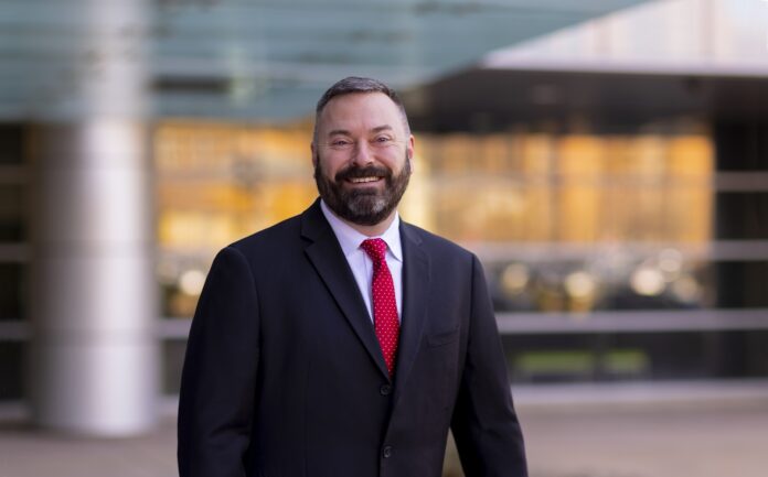 Smith_ Jason_Smith_034_MED Man with beard in dark suit and red tie