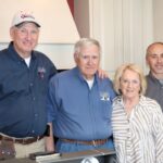 Four people standing