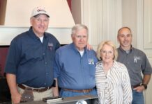 Four people standing