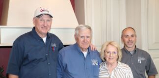 Four people standing