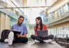 Students reading in the Belknap Academic Building. Photo by Finn Hart.