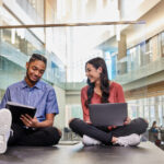 Students reading in the Belknap Academic Building. Photo by Finn Hart.