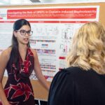 Student demonstrates her poster