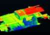 Overhead view of city blocks in blue, red and green shades to show temperature