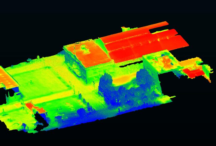 Overhead view of city blocks in blue, red and green shades to show temperature