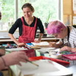 Rachel Singel, associate professor teaching a printmaking studio course