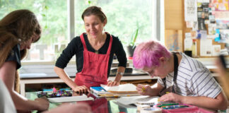 Rachel Singel, associate professor teaching a printmaking studio course