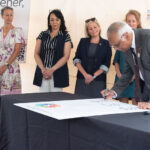 Aruni Bhatnagar, director, Christina Lee Brown Envirome Institute, signing the Greenprint Charter on Aug. 20, 2025.