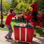 Louie greets those helping with Move-In.