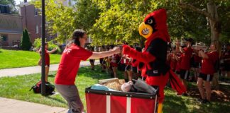 Louie greets those helping with Move-In.